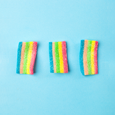 candies with jelly and sugar pattern. colorful array of different childs sweets and treats. Bright...