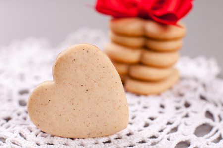 cookies in the shape of heart on a gray background, minimalism, concept of cooking, baking, symbol of loveの写真素材