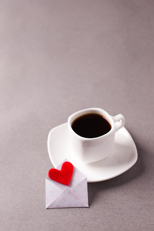 a cup of espresso on a saucer and a love message on Valentine's Day, a declaration of love.の写真素材