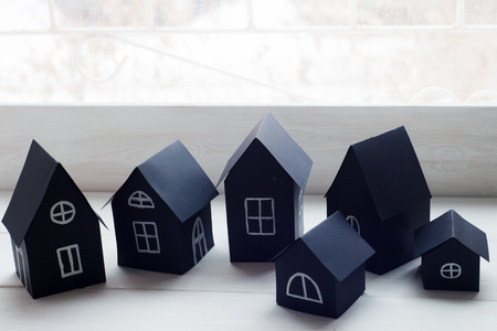 decorative houses on the window - details of the Scandinavian interiorの写真素材