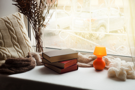 Comfortable place for rest near window in flat. Weekend rest time for readingの写真素材