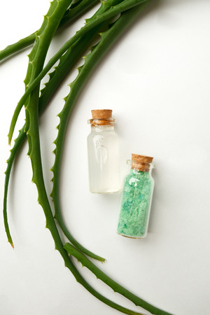 fresh aloe vera leaves, green aromatic spa salt and glass of aloe vera juice on white background, beauty, health closeupの写真素材