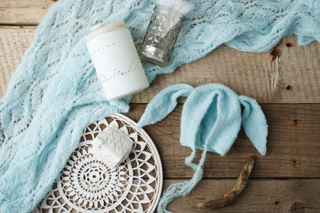 set of handmade knitted hat and blanket for newborn. props for photo sessions. Stylish flat lay, vintage, wooden backgroundの写真素材