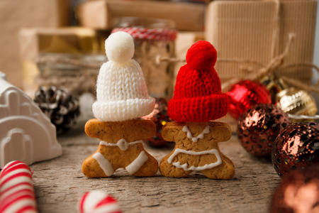 Christmas homemade gingerbread couple cookies on vintage wooden table. Christmas festive closeup