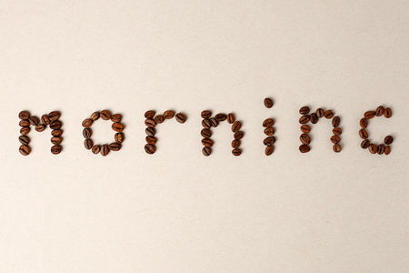 Morning word shaped with coffee beans on gray background, minimal conceptの写真素材