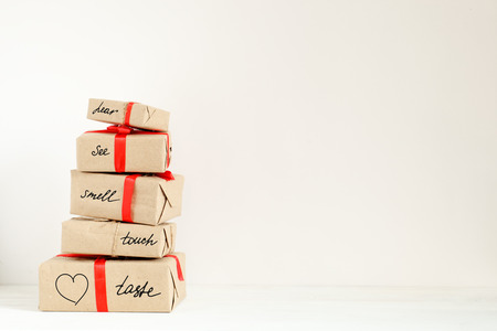 Stack of holiday boxes with suprise on valentine day. Concept of romantic adventure on holiday with copy spaceの写真素材