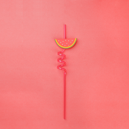Straws for exotic cocktails, concept of vacation, summer, beach relaxation, menu banner, minimalism on a pinkの写真素材
