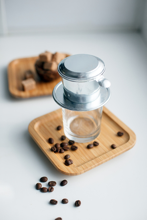 Alternative method of brewing coffee. Filter with ground coffee and glass.の写真素材