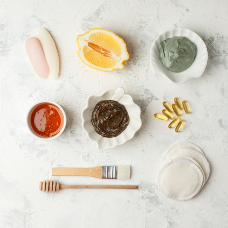 set from natural organic cosmetic products - honey, citrus lemon, coffee scrub, volcanic clay on white background, Beauty, skin or body care concept, copy spaceの写真素材