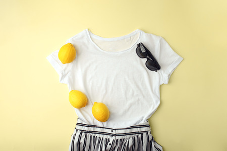 White shirt, sunglasses and lemons on yellowの写真素材