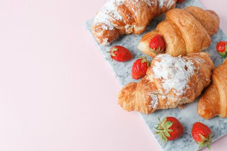Fresh homemade croissants with strawberry and various toppings. Top view. French bakery concept.
の写真素材