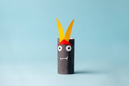 Halloween monster on blue for Halloween concept background. Paper crafts, DIY. Handcraft creative idea fron toilet tube, recycle concept, copy spaceの写真素材
