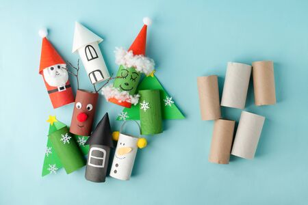 Grinch and city houses from toilet tube roll for winter holiday decor.