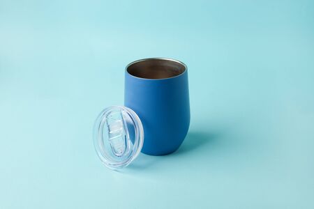 Blue cup on blue background.