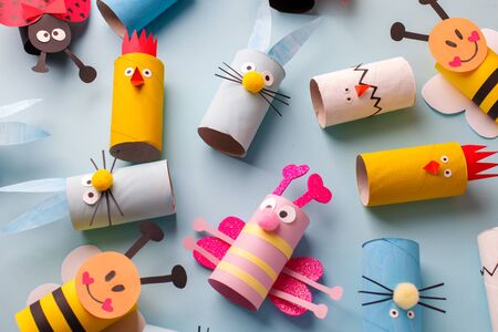 Happy easter kindergarten decoration concept - rabbit, chicken, egg, bee from toilet paper roll tube. Simple diy creative idea. Eco-friendly reuse recycle decor, daycare paper craftの写真素材