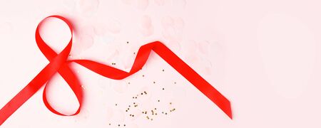 8 March symbol. Figure of eight made of red satin ribbon. Happy womans day design. Decorative greeting holiday card or postcard for international Woman's Day 8 March. Birthday for girl, banner, flyerの写真素材