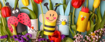 Springtime season greeting card - Decor from toilet roll tube on blue