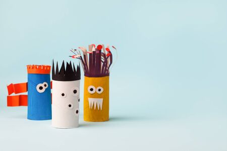 Antistress art therapy for kids, coronavirus pandemic, monsters for Halloween party. Easy crafts for kids on blue background, copy space, diy creative idea from toilet tube, recycle conceptの写真素材