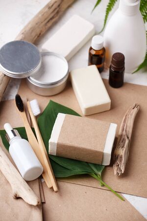Bamboo toothbrushes dentifrice tooth powder natural solid soap, essential oils, dispenser on craft background. Well ness, wellbeing, selfcare concept Eco friendly, Zero waste, Plastic freeの写真素材