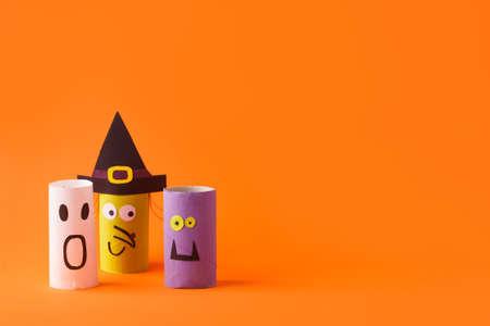 Halloween toy collection on orange for Halloween party concept background. Paper crafts, easy DIY. Handcraft creative idea from toilet tube, recycle reuse, copy space, flyer, bannerの写真素材