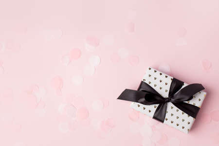 Gift or present box on pastel pink background, Credit card reward point, cash back, bonus for...