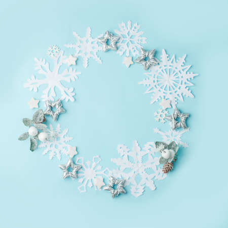 Beautiful snowflakes design wreath for winter. Greeting card for winter, paper art design, minimal concept, copy space, banner for seasonal decoration of your site, stylish creative ideaの写真素材
