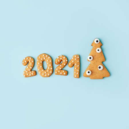 Happy New Year's set of numbers 2021 from ginger biscuits and funny tree glazed sugar icing...