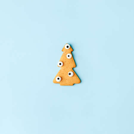 Creative Happy New Year's Christmas card - traditional tree with funny eyes from ginger biscuits...