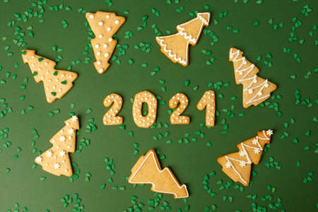 Winter Holiday banner set of gingerbread on natural green background - Number Happy New Year 2021,...