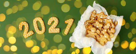 Happy New Year's set of cookies on green bokeh lights