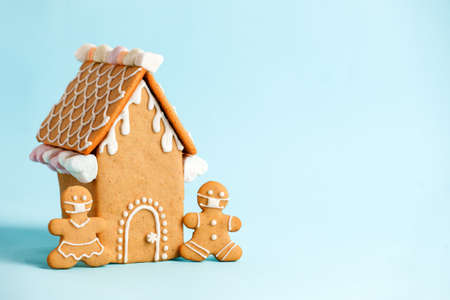 Happy New Year's set of house, gingerbread man in face mask from ginger biscuits glazed sugar icing...