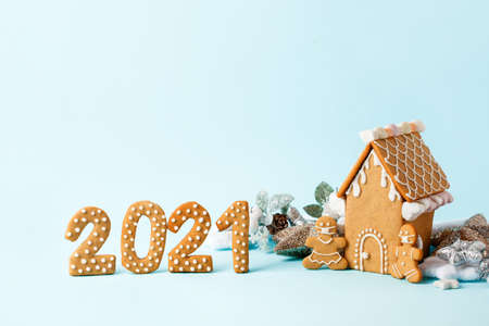 Happy New Year's set of numbers 2021, gingerbread man in face mask from ginger biscuits glazed sugar...
