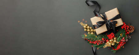 Craft gift box, christmas decorations on dark background, stylish luxury happy new 2021 year...