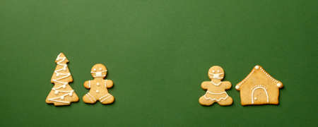 Happy New Year's set of cookies, gingerbread man and woman in face mask, xmas tree, sweet home...
