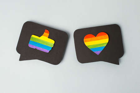 Happy Pride month banner for lgbt rights or social issues event. Colorful rainbow heart and thumb up...