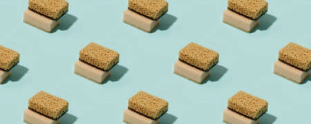 Seamless Pattern with neutral beige clean sponges for home cleaning on blue background. Banner for...
