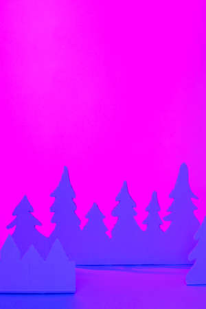 Futuristic modern abstract happy New Year 2022, Merry Chrstmas concept. Pine tree from paper on neon bright violet blue background, copy space, banner for your site, invitation, flyerの写真素材