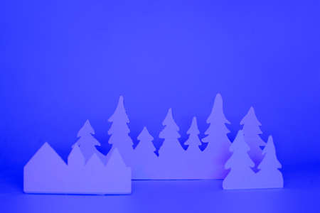 Futuristic modern abstract happy New Year 2022, Merry Chrstmas concept. Pine tree from paper on neon bright violet blue background, copy space, banner for your site, invitation, flyerの写真素材