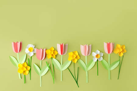 Happy easter spring concet - papercraft seasonal flowers on blue background for kids holiday party concept background. Handicrafts, DIY. creative idea from paper, copy space, banner, flyerの写真素材