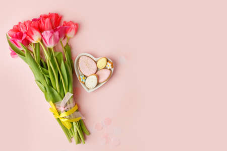 Easter floral background, various gingerbread glazed cookies end decorated with natural botanical elements on pink, flat lay, view from above, blank space for greeting text, banner, flyer, couponの写真素材