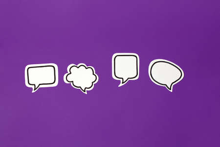 Halloween paper decorations chat bubble mock up on purple background. Flat lay, top view, minimal style, copy space, banner for your site, party invitation, flyer, traditional colorの写真素材