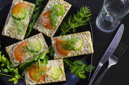 Diet sandwich with cheese and vegetables on a plateの写真素材