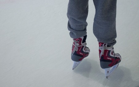 People skating at the rink in the winterの写真素材