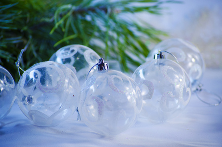 White Christmas balls on the Christmas tree closeupの写真素材