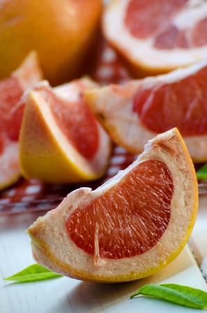 sliced ripe grapefruit on a white backgroundの写真素材