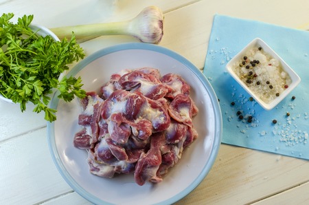 Chicken stomach with spices ready for cookingの写真素材
