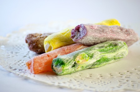 Turkish sweets with nuts of different flavors are placed on a white backgroundの写真素材