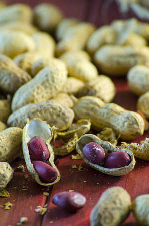 Peanuts in a shell on a tableの写真素材