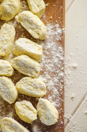 Cooking homemade dumplings with cottage cheese top viewの写真素材