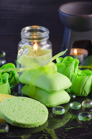 Soap and a variety of accessories for a spa on a black backgroundの写真素材